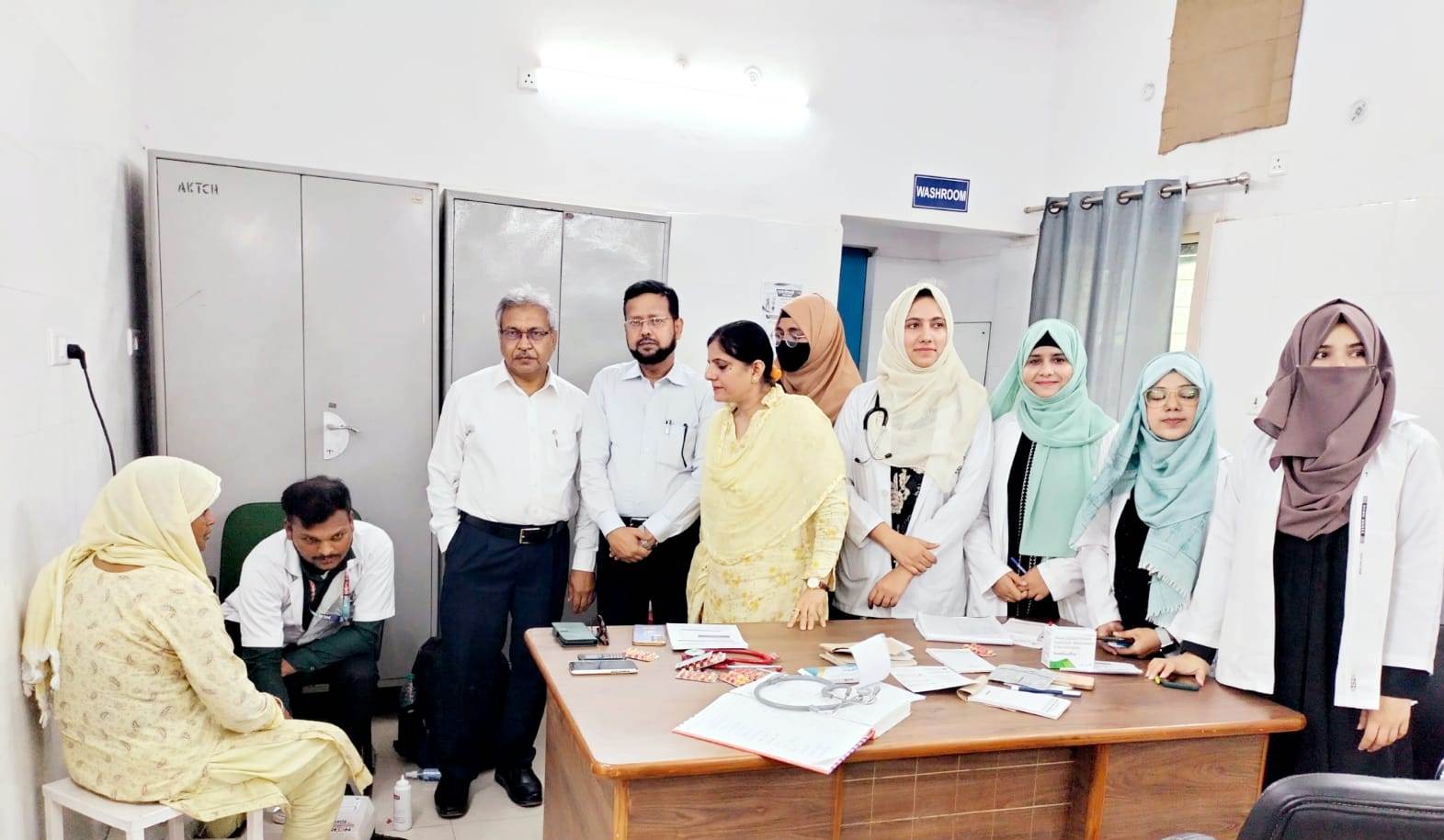 Prof BD Khan Prof Asia Sultana and Prof Mohd Anwar with resident during the BMD Screening the health camp.jpg