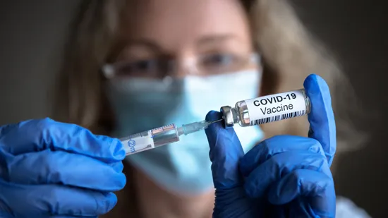 COVID-19-vaccine-syringe-bottle-with-vaccine-coronavirus.webp